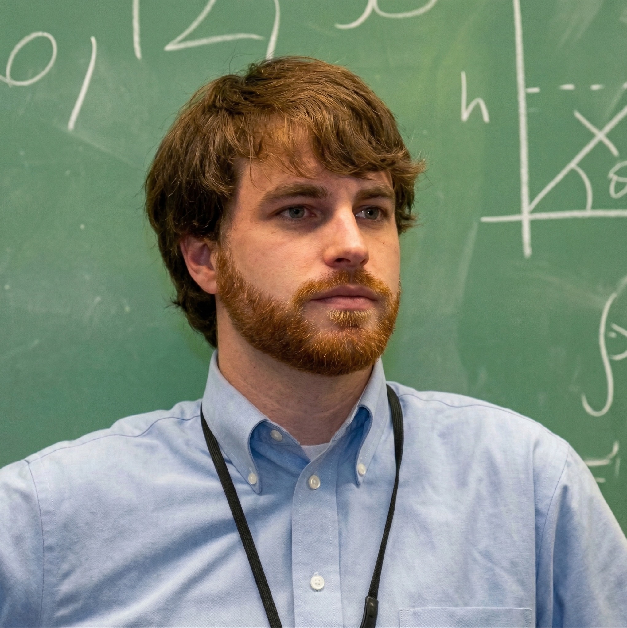 Nathan Wall teaching at a whiteboard